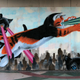 Image for article titled The greatest laser cat mural in the universe